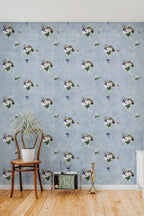 Room interior with floral wallpaper, wooden chair, and decorative items.