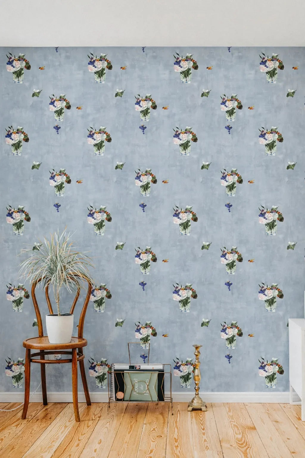 Room interior with floral wallpaper, wooden chair, and decorative items.