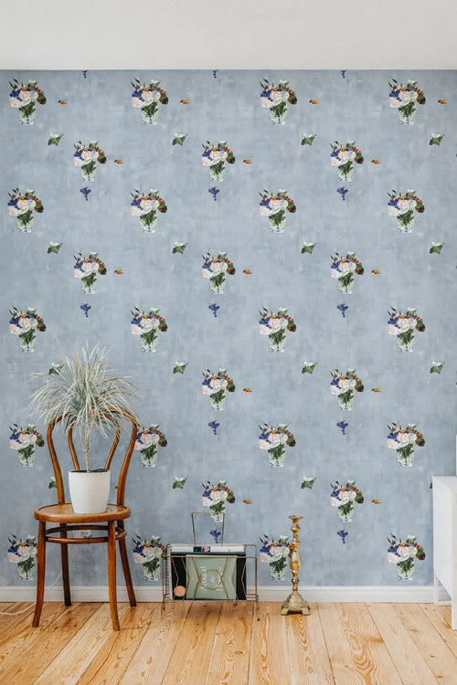 Room interior with floral wallpaper, wooden chair, and decorative items.