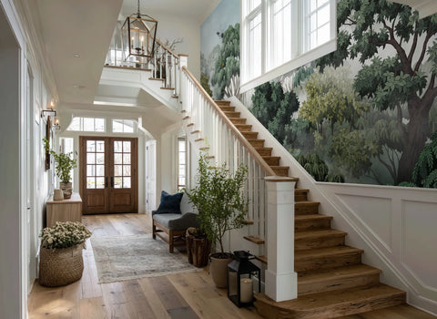 Staircase in a home with wooden steps, white railings, and a wallpaper mural of a rainforest.