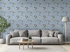 Living room with gray sofa, coffee table, and decorative floral wall paper.