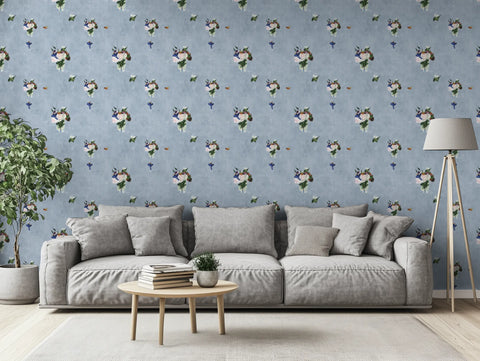 Living room with gray sofa, coffee table, and decorative floral wall paper.