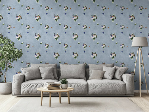 Living room with gray sofa, coffee table, and decorative floral wall paper.