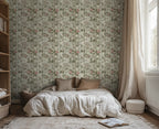 Bedroom with white sheets and floral wallpaper. 
