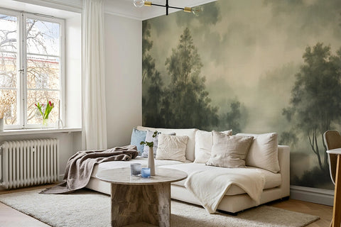 Living room with an ethereal forest wallpaper mural, white sofa, and wooden coffee table.