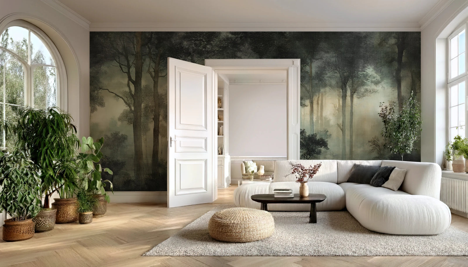 Modern living room with a large forest wallpaper mural on the wall, white sofa, and decorative plants.