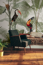 Tropical mural wallpaper in a living room, jungle design with parrots, toucans, and palm trees