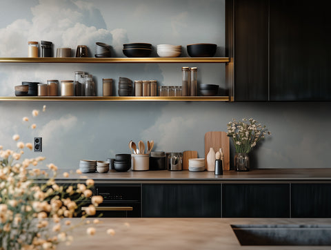 A wallpaper mural showing big white clouds, seen on the wall of a modern kitchen. 
