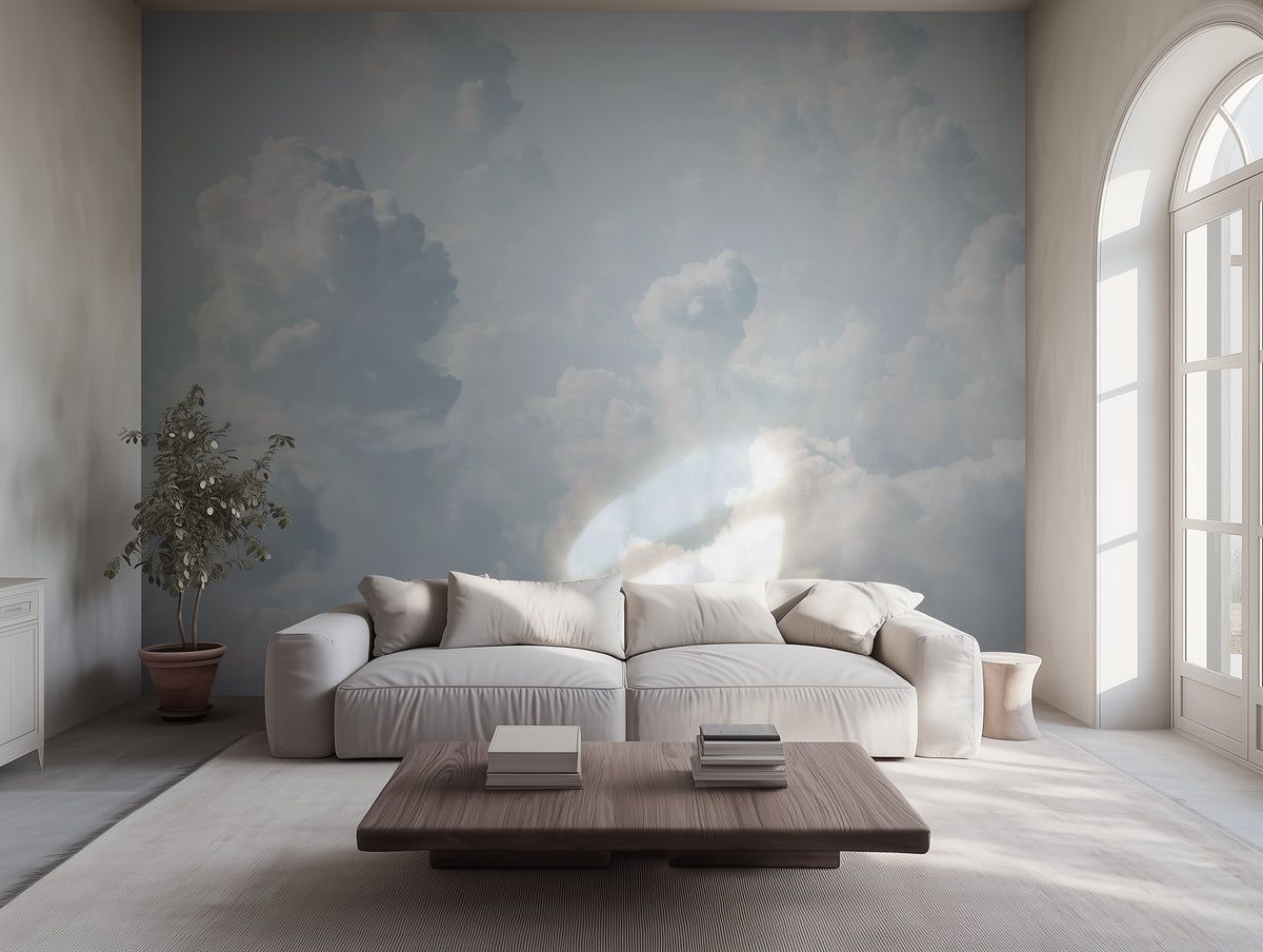 A wallpaper mural from a photograph featuring a pale sky filled with white clouds, displayed in a bright room with a sofa and wooden coffee table.