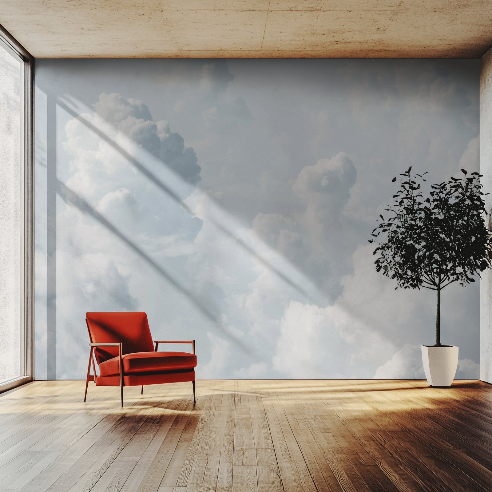 A big wallpaper mural showing a sky full of white clouds, seen in a lounge with a red chair and a tree. 
