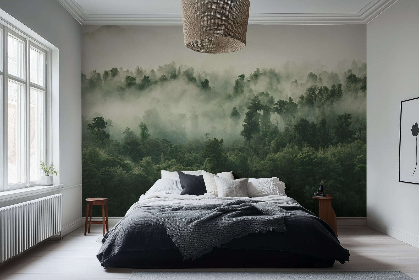 A misty forest wallpaper mural covering a large wall behind a bed in a bedroom setting.
