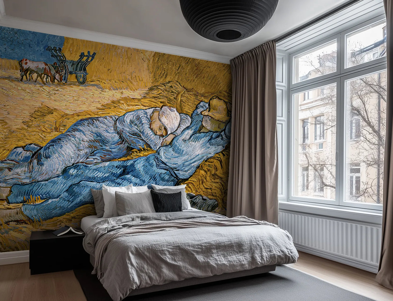 Modern bedroom wth a bed, grey sheets, and a large wallpaper mural of Van Gogh's "The Siesta"
