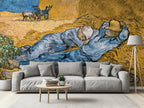 Modern living room wth a grey sofa, and a large wallpaper mural of Van Gogh's "The Siesta"