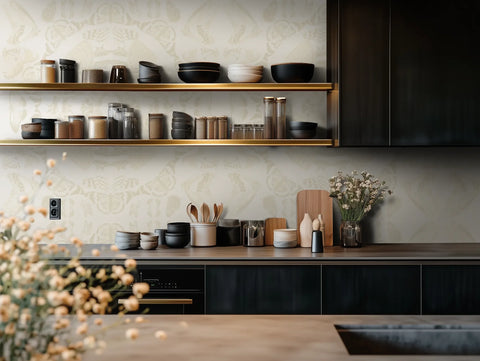 Modern kitchen with black cabinets, wooden shelves, and beige butterfly wallpaper pattern.