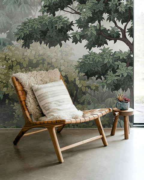 Wooden chair with cushions against a forest-themed wallpaper