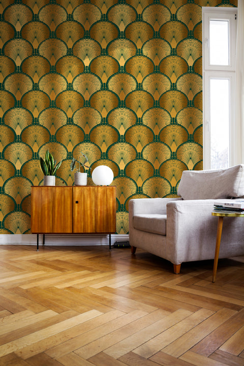 Living room with patterned green and gold art deco wallpaper, wooden sideboard, and gray sofa.