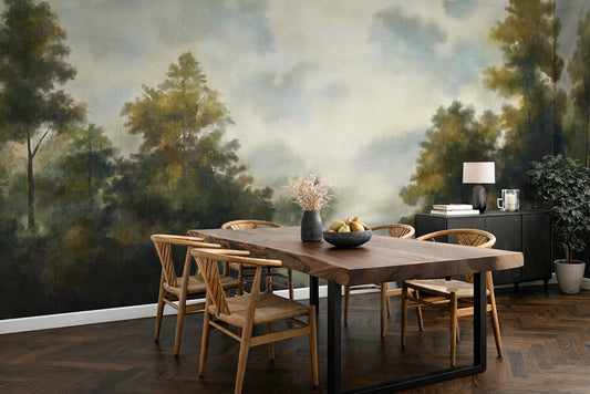 Dining room with a large wooden table and chairs, featuring a wallpaper forest mural on the wall.