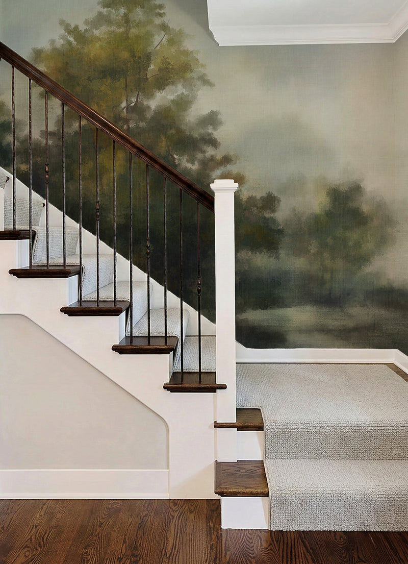 Forest mural biophilic wallpaper in staircase, lush green trees wall mural, nature-inspired interior design.