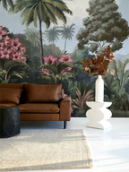 Modern living room with a leather sofa and tropical vintage wallpaper