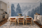 Blue forest wallpaper mural in a cozy Scandinavian dining room with soft neutral furniture, textured decor, and misty Nordic trees inspired by fjord landscapes.