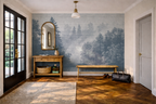Blue forest wallpaper mural in a homely hallway with soft neutral furniture, textured decor, and misty Nordic trees inspired by fjord landscapes.
