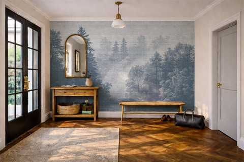 Blue forest wallpaper mural in a homely hallway with soft neutral furniture, textured decor, and misty Nordic trees inspired by fjord landscapes.