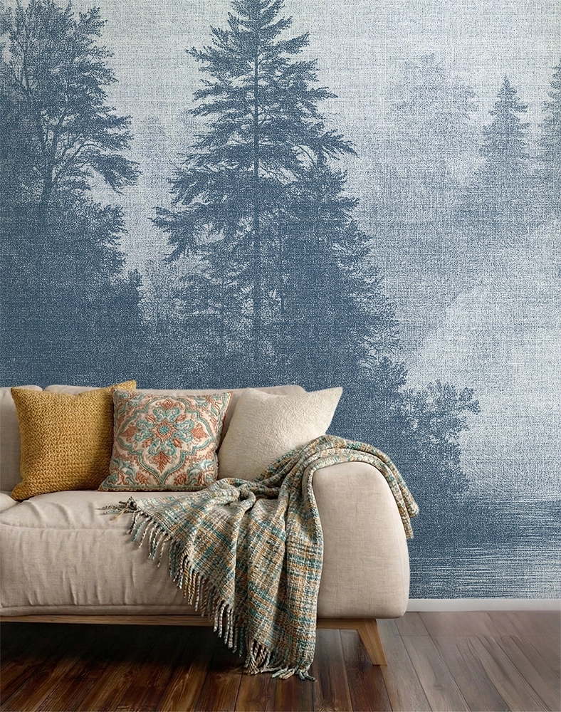 Blue forest wallpaper mural in a cozy Scandinavian living room with soft neutral sofa, textured decor, and misty Nordic trees inspired by fjord landscapes.