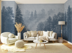 Blue forest wallpaper mural in a cozy Scandinavian living room with soft neutral furniture, textured decor, and misty Nordic trees inspired by fjord landscapes.