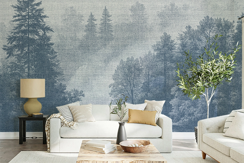 Blue forest wallpaper mural in a cozy Scandinavian living room with soft neutral furniture, textured decor, and misty Nordic trees inspired by fjord landscapes.