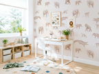 Children's room with desk, shelves, and animal-themed wallpaper