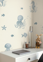 Wall with underwater-themed wallpaper including octopus, fish, and seahorse on a light-colored wall.