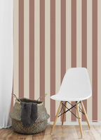 White chair and woven basket against striped brown kids wallpaper