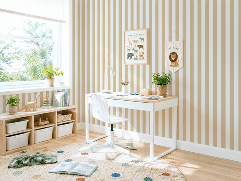 Children's room with a desk, shelves, and striped yellow wallpaper.