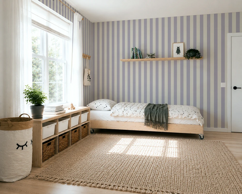 Kids room with striped wallpaper, wooden bed and decorative elements.