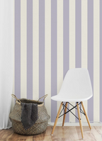 White chair and woven basket against a striped purple wallpaper