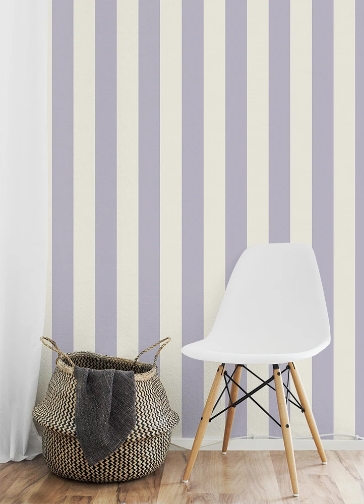 White chair and woven basket against a striped purple wallpaper