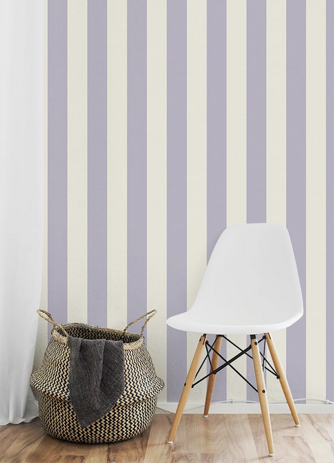 White chair and woven basket against a striped purple wallpaper