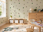 Children's playroom with kids wallpaper, wooden furniture, toys.