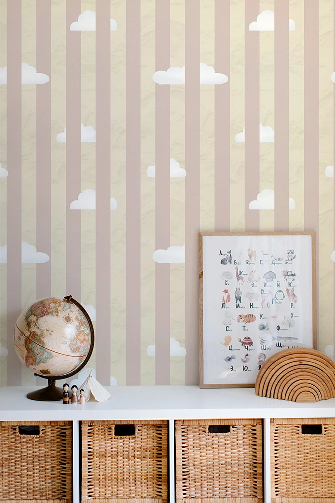 Kids wallpaper with cloud pattern, shelf with decorative items, and framed artwork.