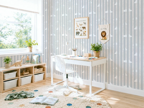 Children's room with striped wallpaper, a desk, shelves, and decorative elements.