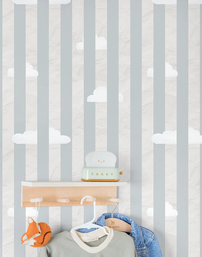 Children's room with striped cloudy wallpaper, shelves, and toys.