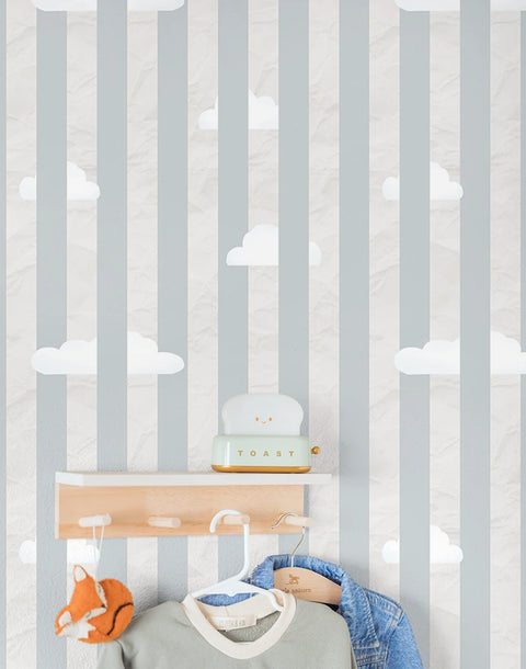 Children's room with striped cloudy wallpaper, shelves, and toys.