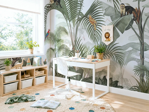 Children's room with jungle-themed wallpaper, desk, and toys.