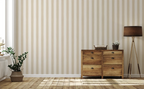 Wooden dresser with decorative items against a wall with a beige striped wallpaper pattern.
