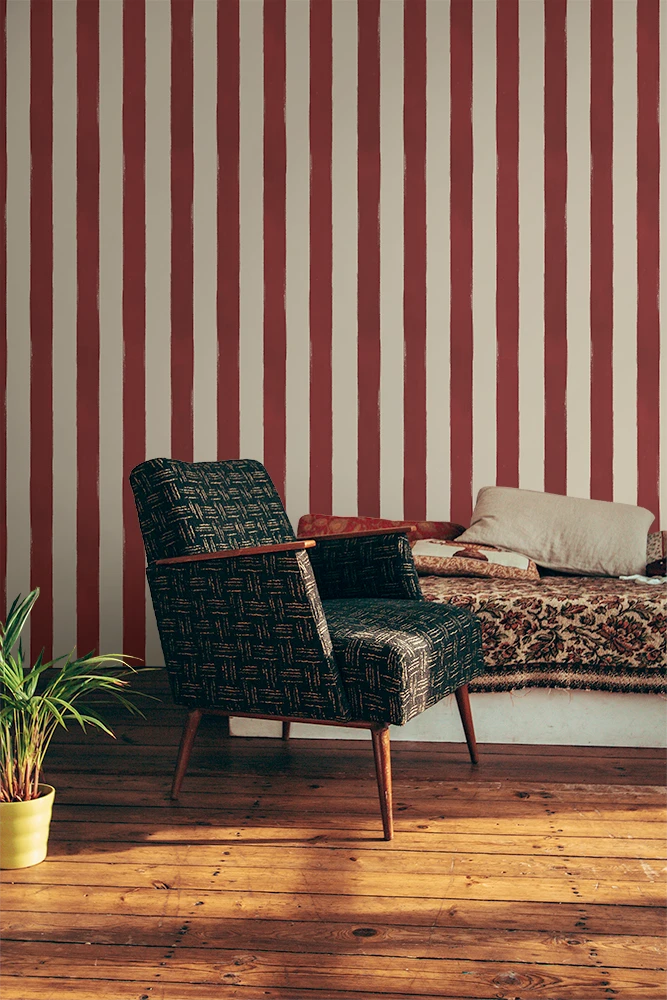 Chair in a room with red and white striped wallpaper