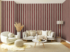 Living room with red and white hand drawn striped wallpaper, white sofa, and decorative items.