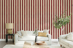 Living room with white sofa, striped red and white wallpaper, and decorative elements.