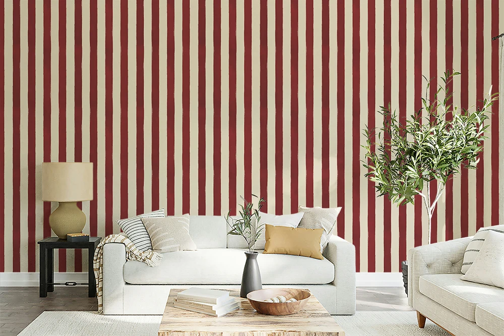 Living room with white sofa, striped red and white wallpaper, and decorative elements.