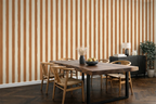 Dining room with wooden table and chairs against a caramel striped wallpaper.