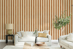 Living room with striped brown wallpaper, white sofa, and decorative elements.